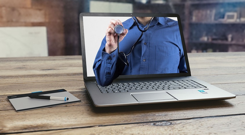 Doctor telemedicine laptop and Virtual Care Manager